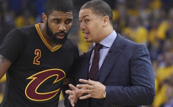 Jun 12, 2017; Oakland, CA, USA; Cleveland Cavaliers head coach Tyronn Lue talks with guard Kyrie Irving (2) against the Golden State Warriors during the first quarter in game five of the 2017 NBA Finals at Oracle Arena. Mandatory Credit: Kyle Terada-USA TODAY Sports